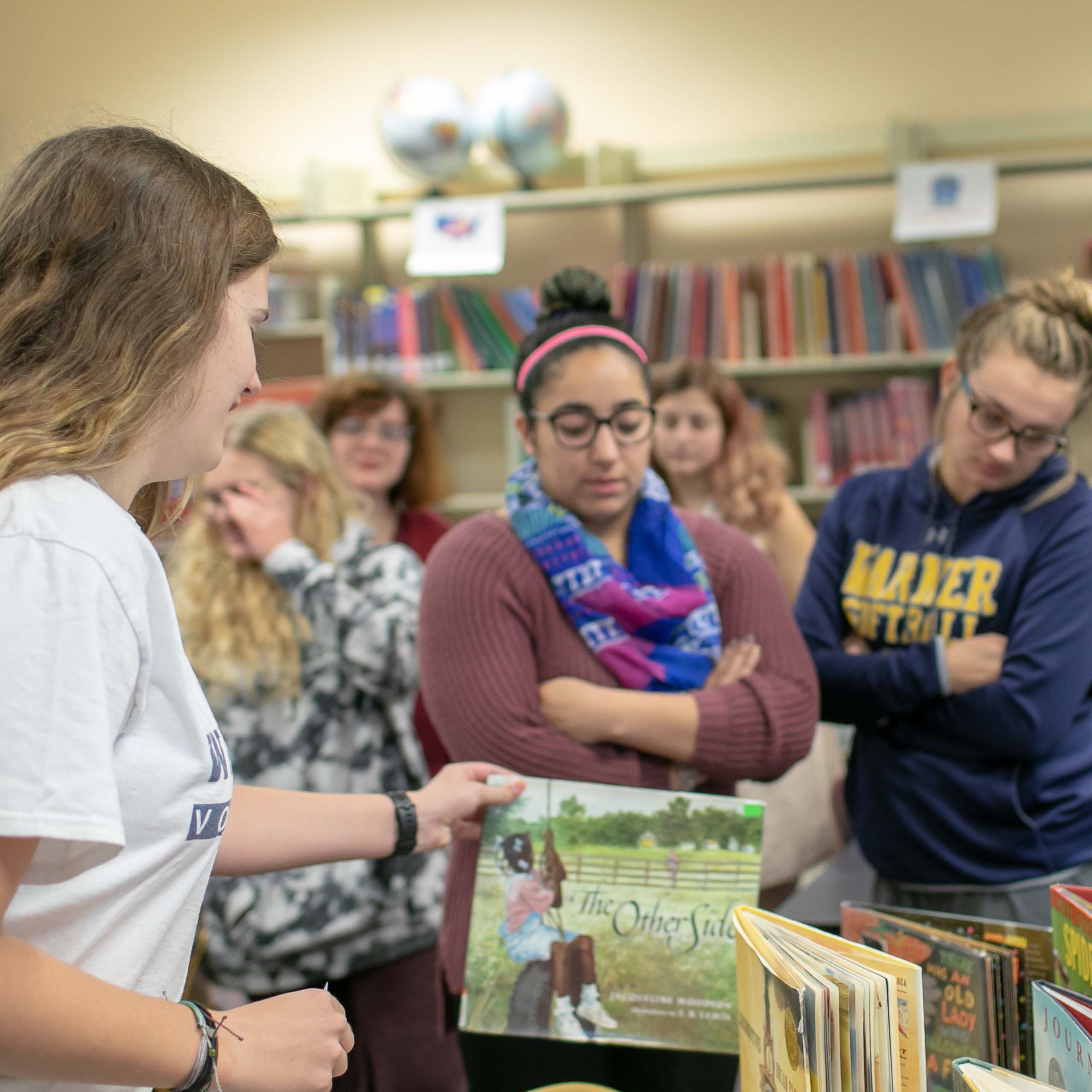 A group of students experience a mock elementary book fair